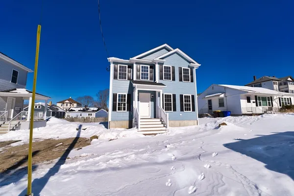 a front view of a house with yard