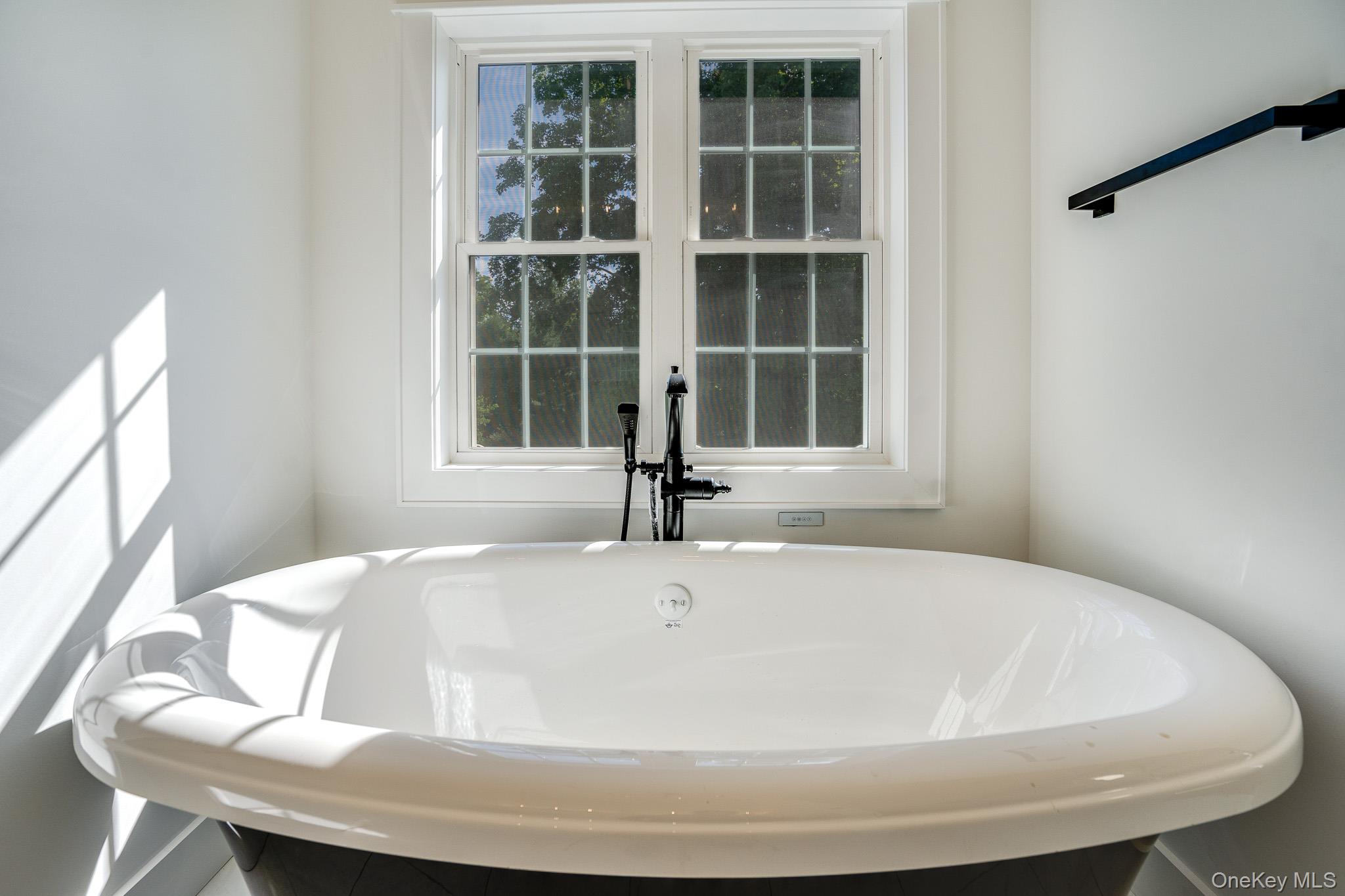 Lot 2 Hillside Lake Road Wappingers Falls, NY 12590 - Photo 17 of 28 a white bath tub sitting next to a window