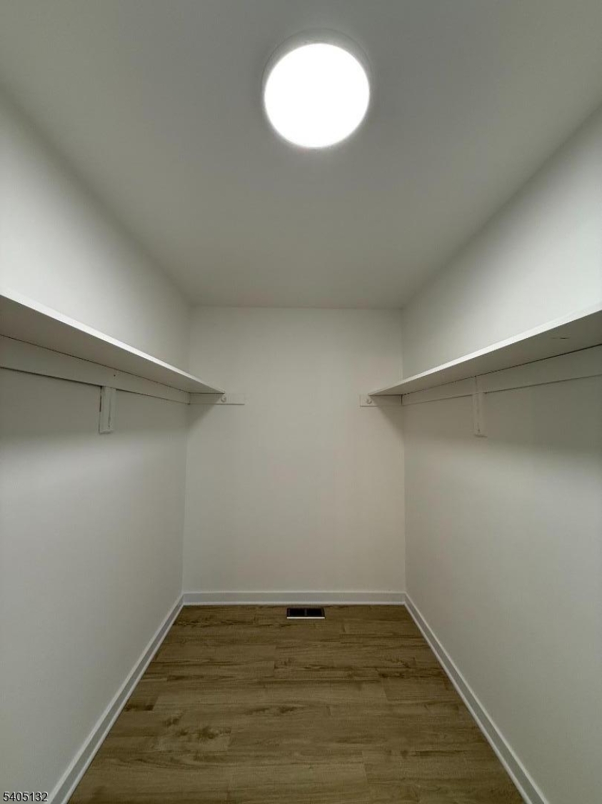 4202 Winder Drive Bridgewater, NJ 08807 - Photo 18 of 26 a view of an empty room with wooden floor and a window