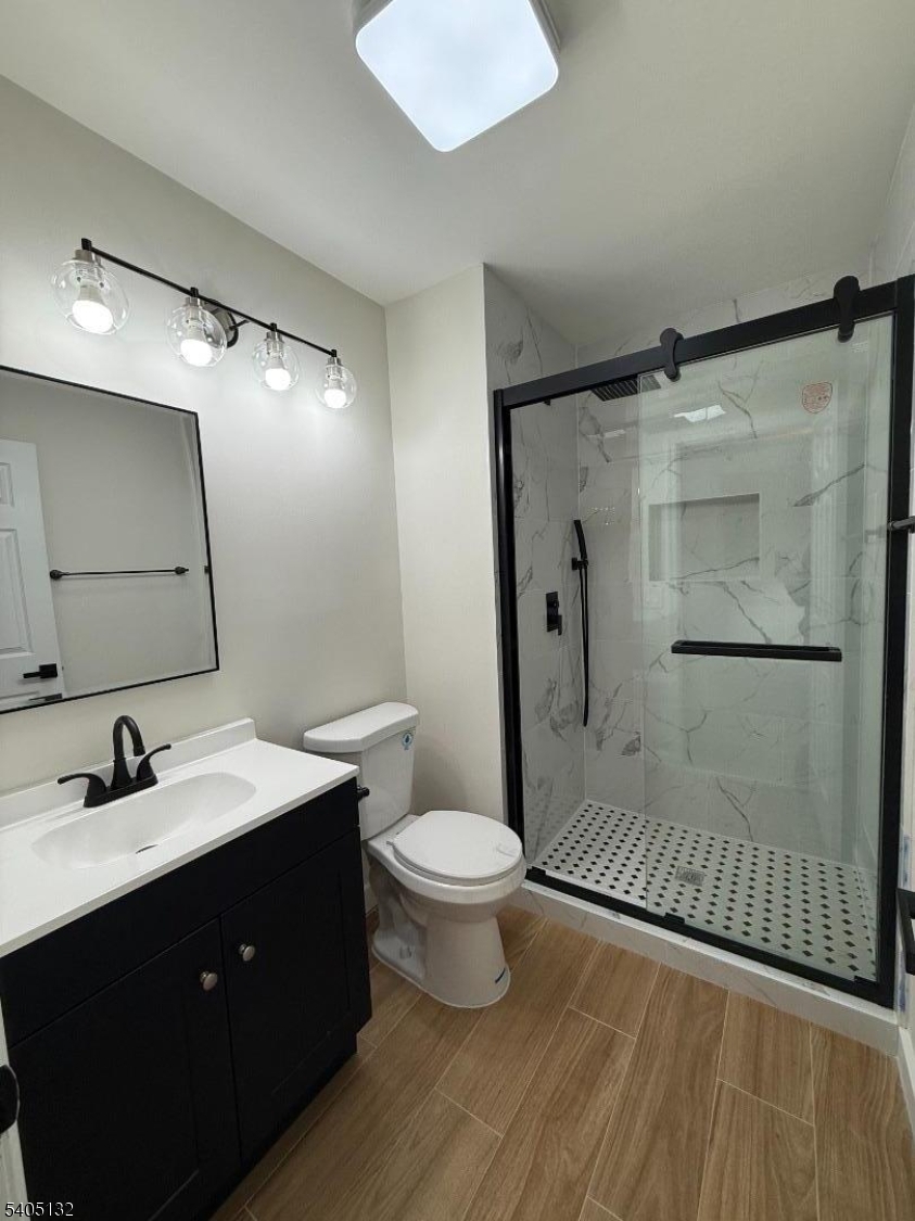 4202 Winder Drive Bridgewater, NJ 08807 - Photo 19 of 26 a bathroom with a sink toilet and shower