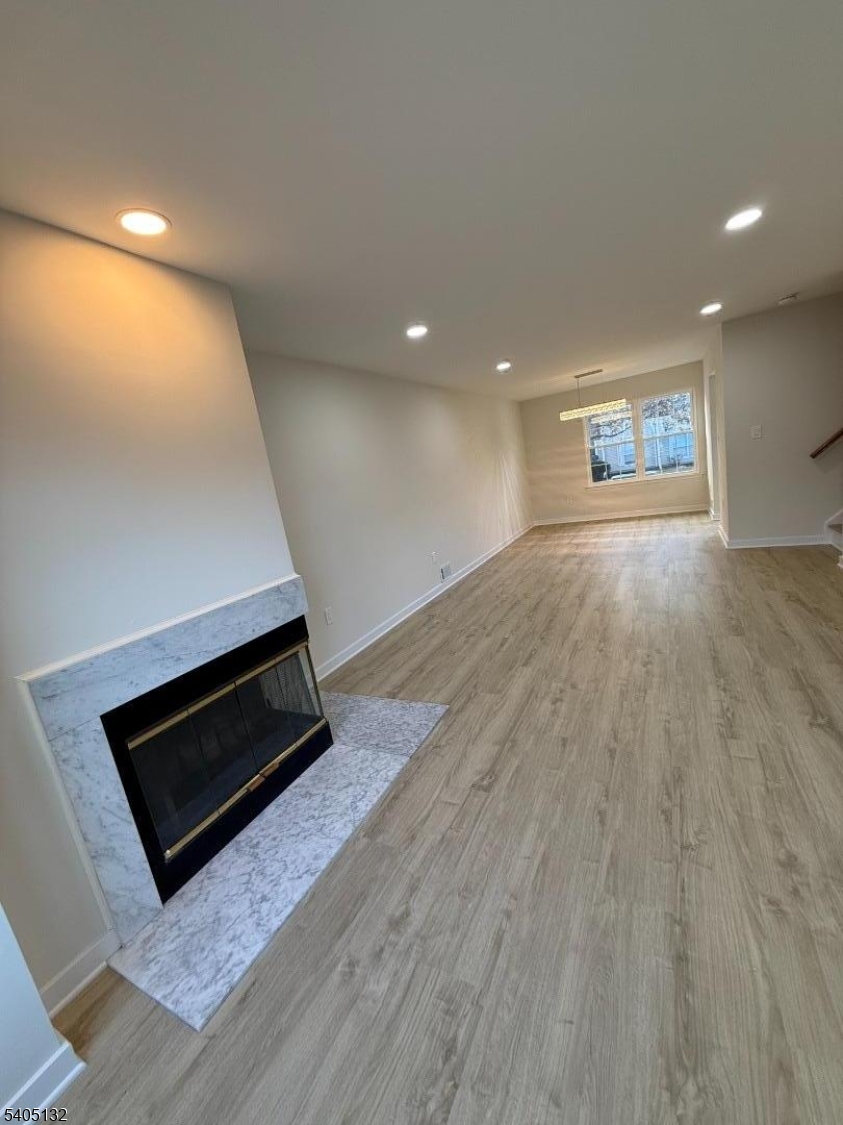 4202 Winder Drive Bridgewater, NJ 08807 - Photo 6 of 26 an empty room with wooden floor and windows