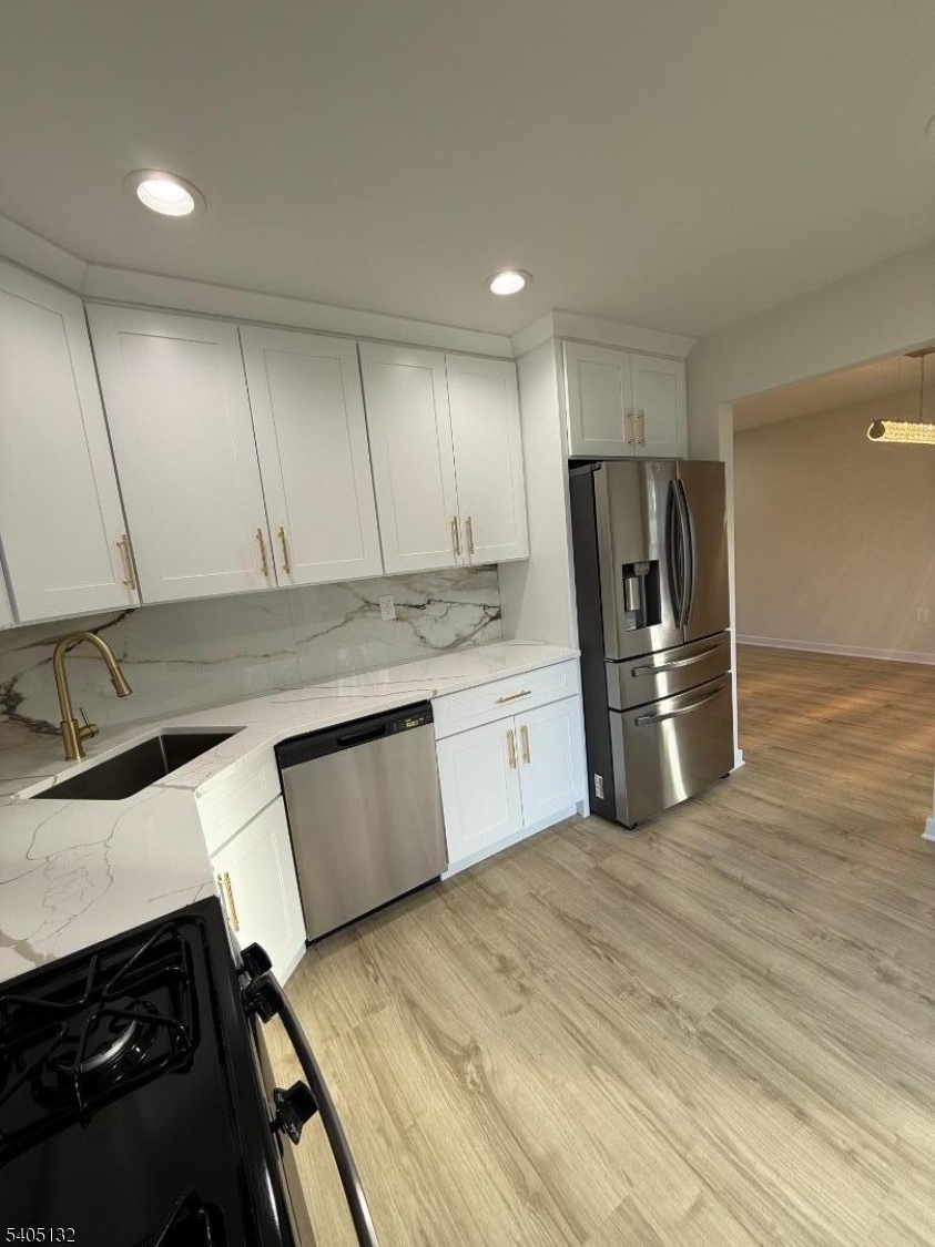 4202 Winder Drive Bridgewater, NJ 08807 - Photo 10 of 26 a kitchen with a stove sink and refrigerator