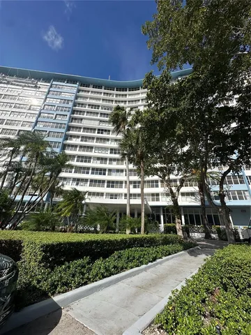 a view of a building with a garden