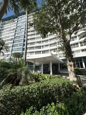 a view of a building with a garden