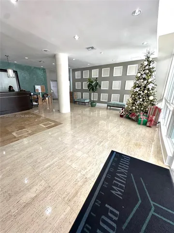 a view of kitchen with furniture and staircase
