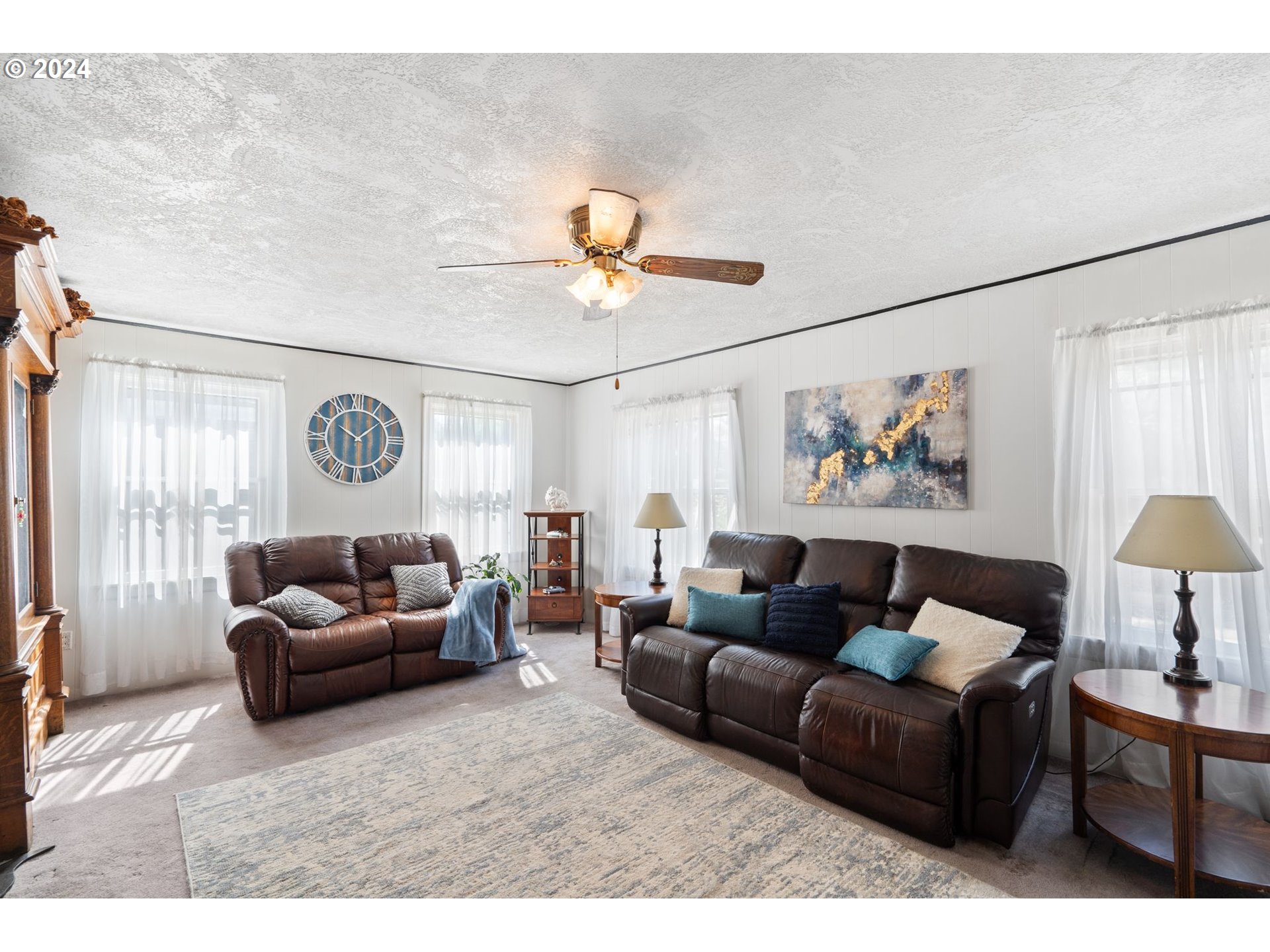 5811 Southeast Knight Street Portland, OR 97206 - Photo 2 of 9 a living room with furniture a chandelier and a window