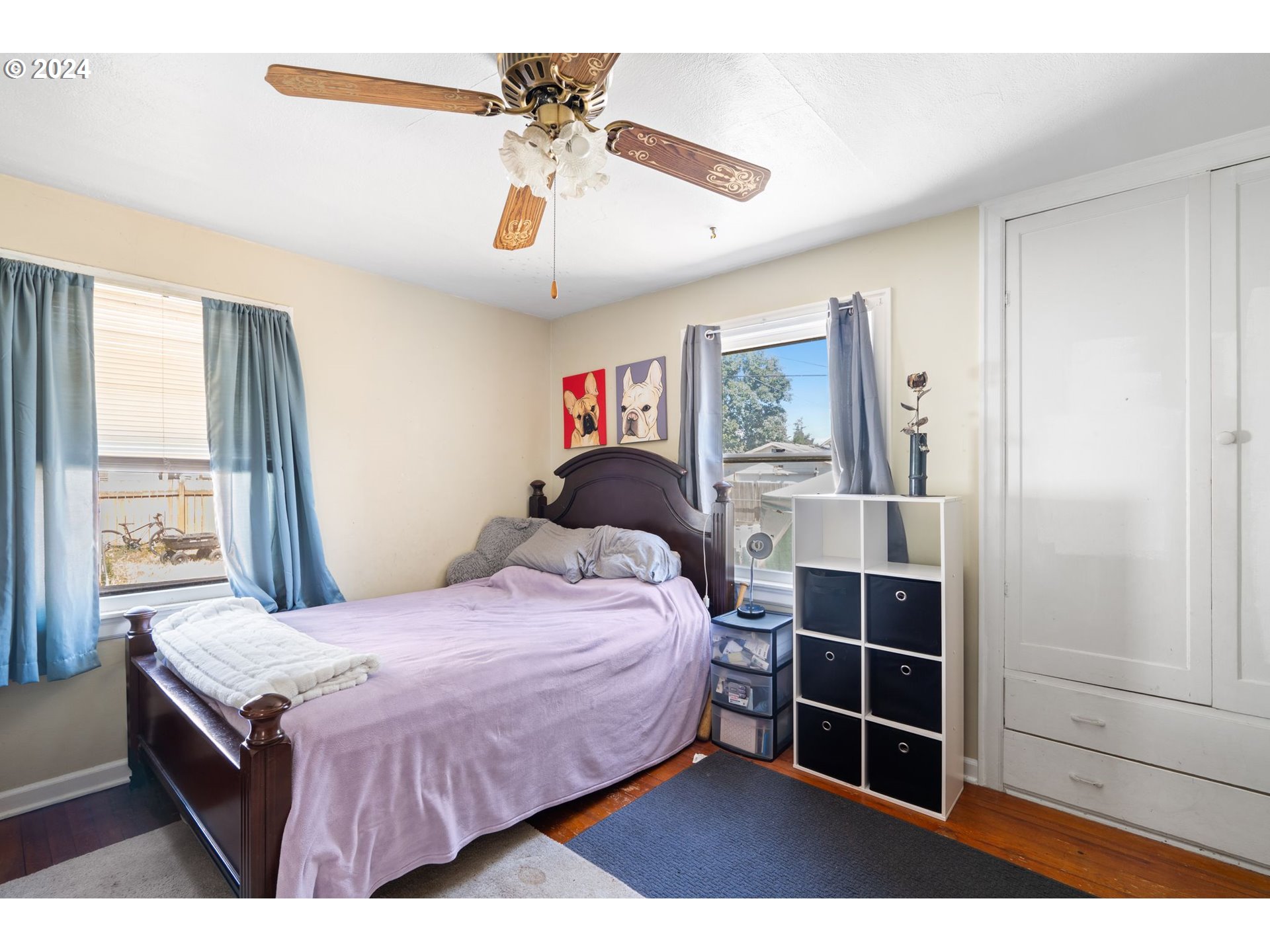 5811 Southeast Knight Street Portland, OR 97206 - Photo 6 of 9 a bedroom with a bed and a window
