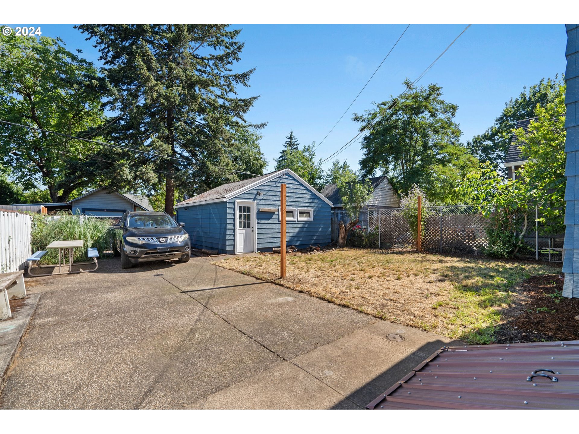 5811 Southeast Knight Street Portland, OR 97206 - Photo 9 of 9 a house view with a wooden fence and a pathway