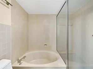 a bathroom with a white bath tub