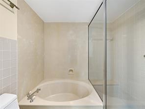 5054 Golfview Court, Unit 1514 Delray Beach, FL 33484 - Photo 12 of 27 a bathroom with a white bath tub