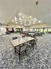 a kitchen with a table and chairs