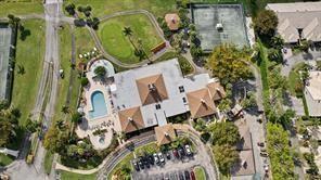 5054 Golfview Court, Unit 1514 Delray Beach, FL 33484 - Photo 22 of 27 an aerial view of a residential apartment building with entryway