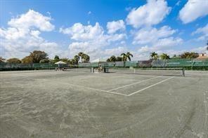 5054 Golfview Court, Unit 1514 Delray Beach, FL 33484 - Photo 24 of 27 a view of a tennis court