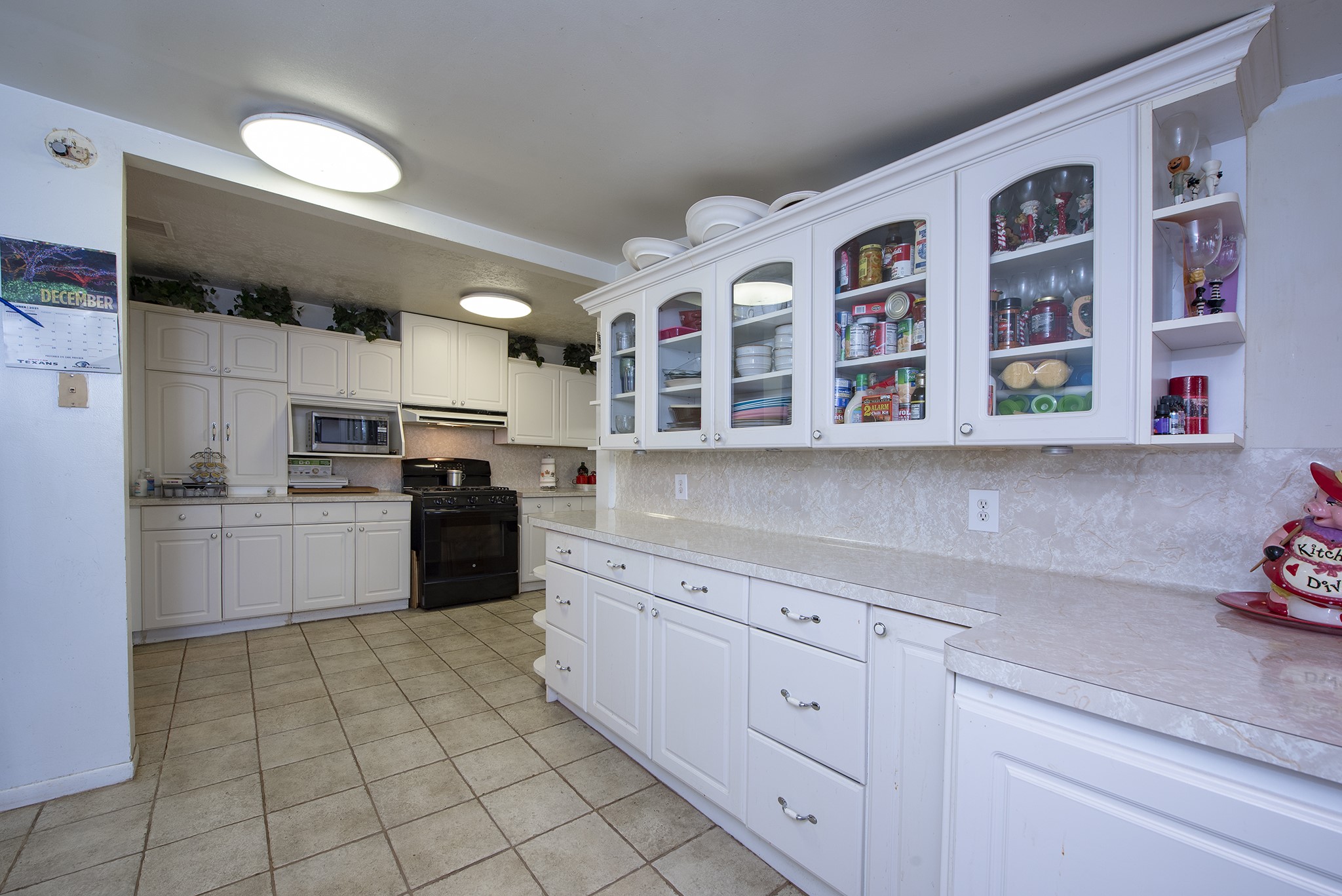 22234 Castle Road Waller, TX 77484 - Photo 37 of 50 a kitchen with stainless steel appliances granite countertop a refrigerator and a sink