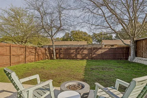 a view of a backyard with furniture