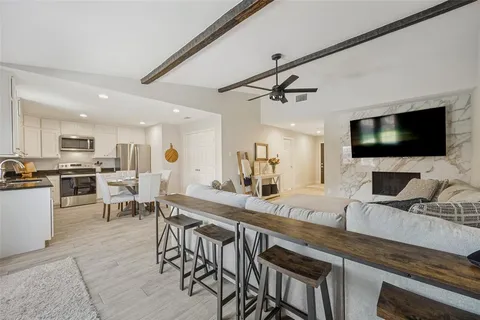 a kitchen with a table and chairs in it