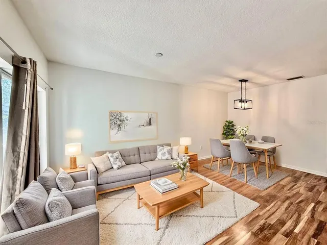 a living room with furniture and a table