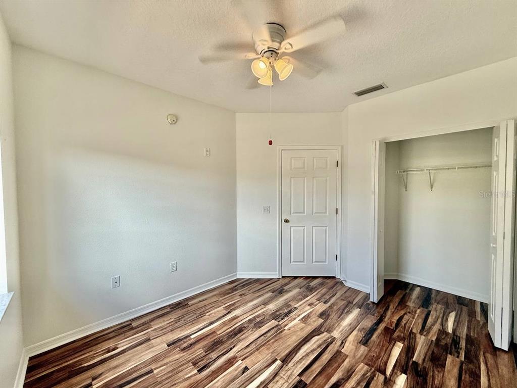 6014 Portsdale Place, Unit 202 Riverview, FL 33578 - Photo 24 of 29 a view of a room with wooden floor
