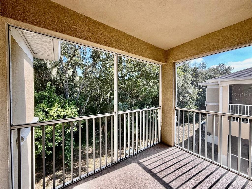 6014 Portsdale Place, Unit 202 Riverview, FL 33578 - Photo 26 of 29 a view of a balcony with wooden floor