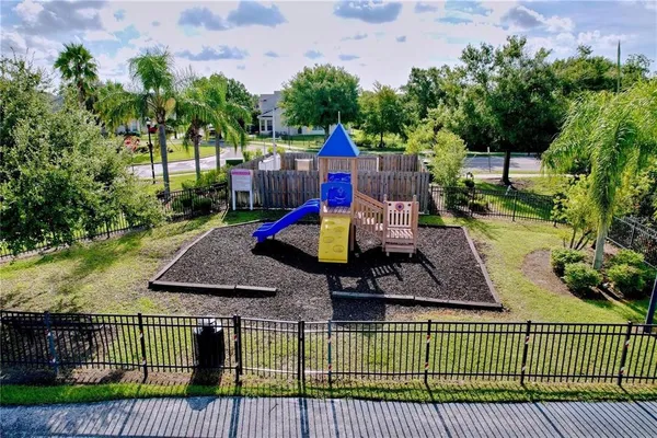 an aerial view of a house with garden space and street view