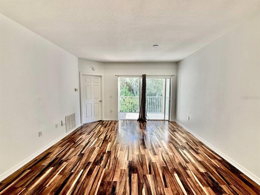 6014 Portsdale Place, Unit 202 Riverview, FL 33578 - Photo 8 of 29 a view of wooden floor in an empty room