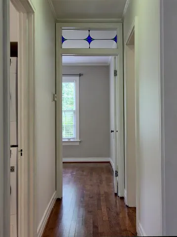 a view of a livingroom with wooden floor a fireplace and window