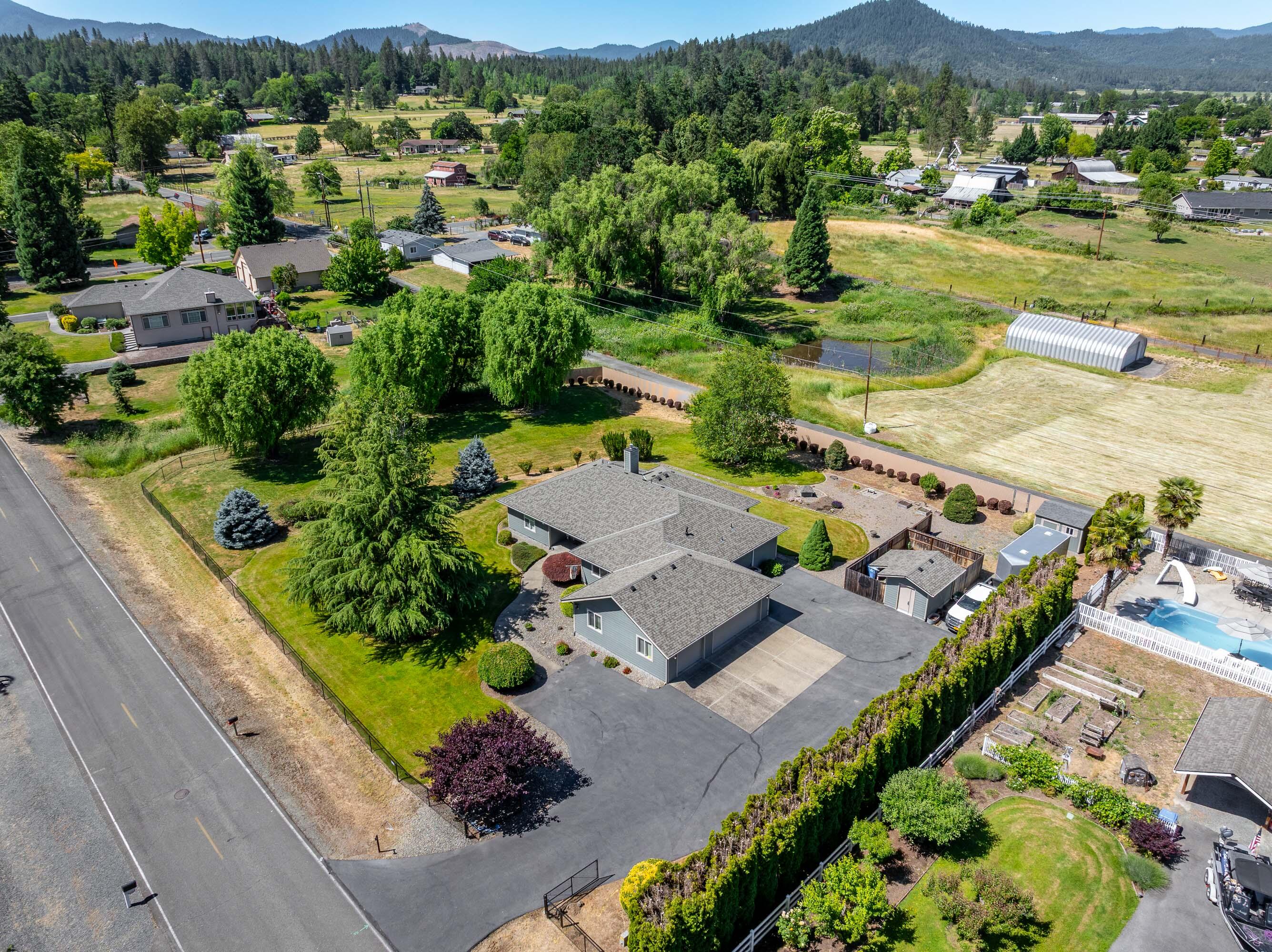 974 Felicia Lane Grants Pass, OR 97527 - Photo 31 of 36 an aerial view of residential houses with outdoor space and street view