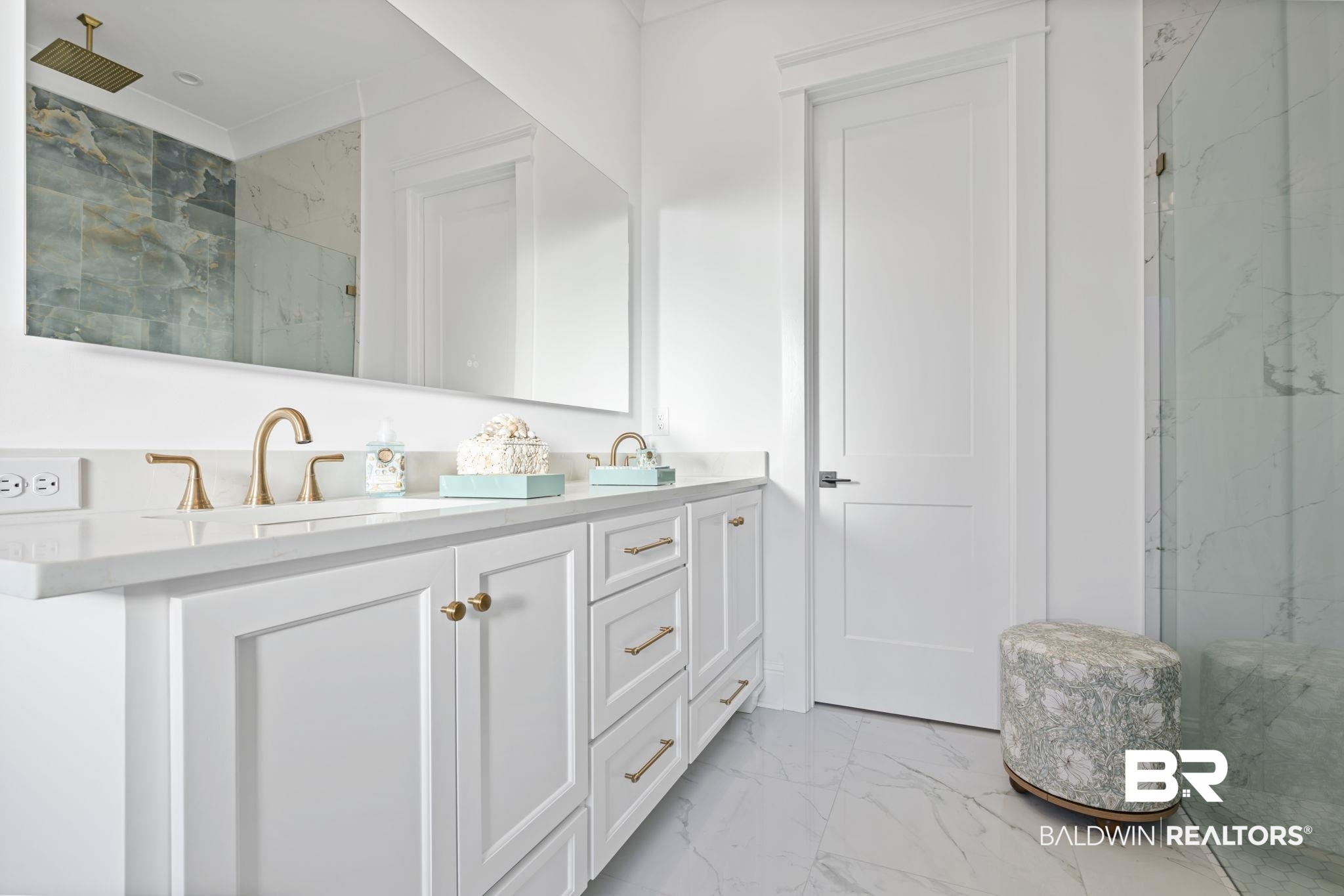 30313 River Road Orange Beach, AL 36561 - Photo 27 of 50 Bathroom with light marble finish flooring, a marble finish shower, and double vanity