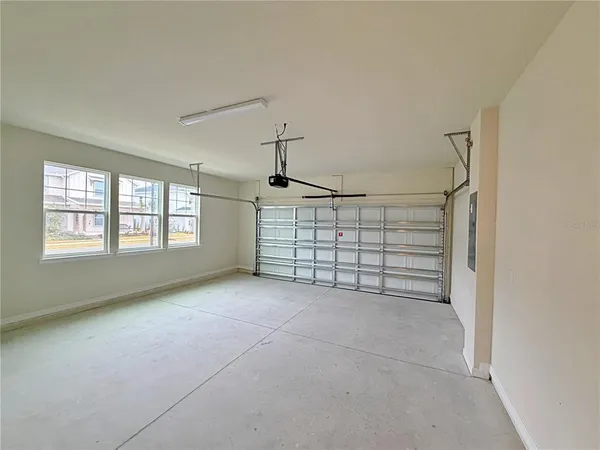 a view of an empty room with windows