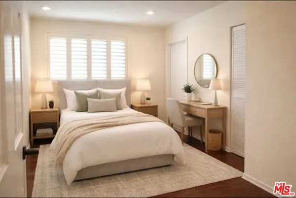 a bedroom with a bed and window