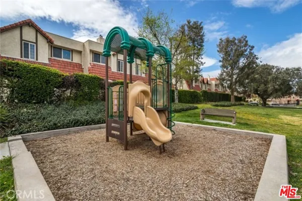 a view of a park with large trees