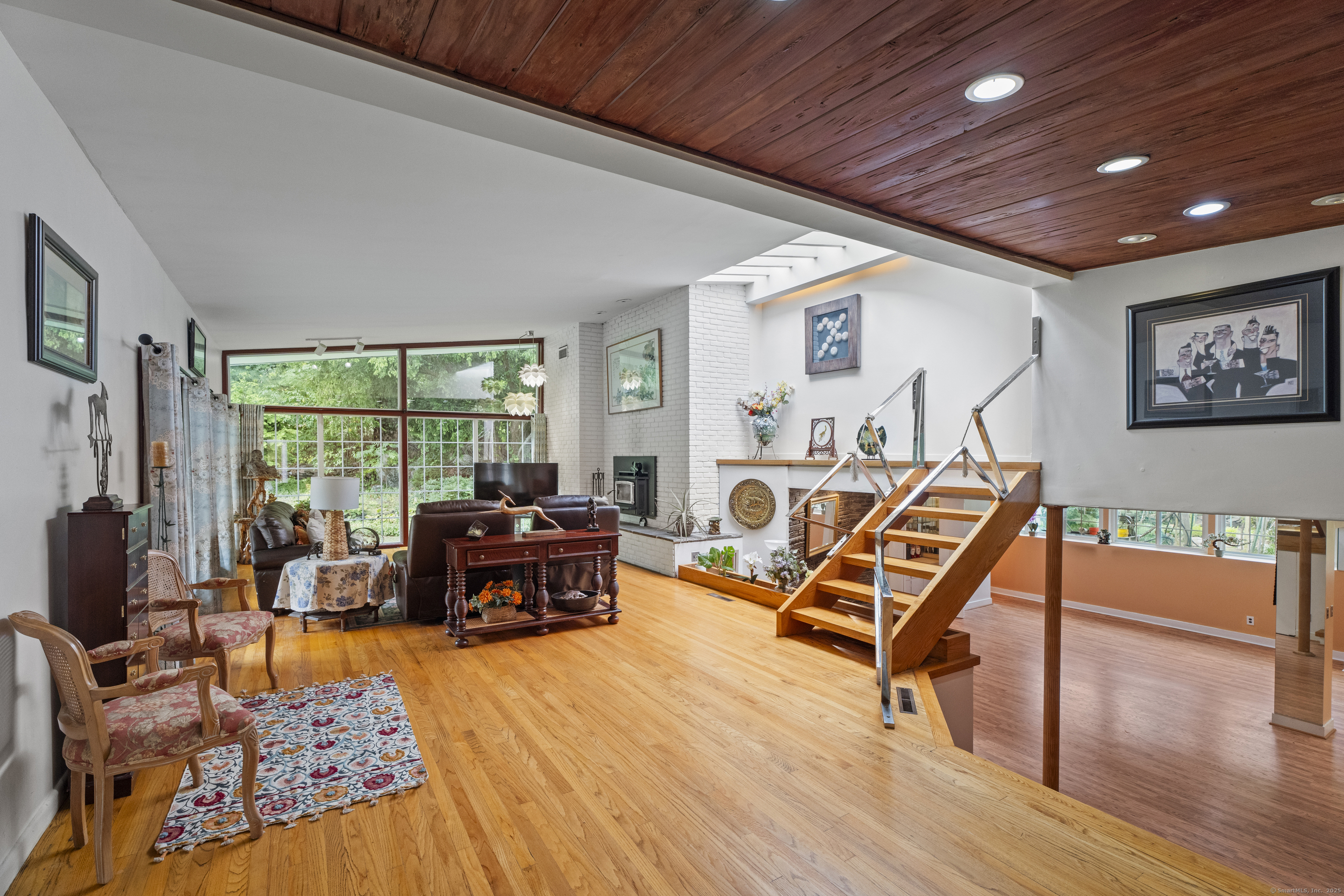 46 Tumblebrook Road Woodbridge, CT 06525 - Photo 12 of 37 Step down to from the beautiful living room into the amazing lower level