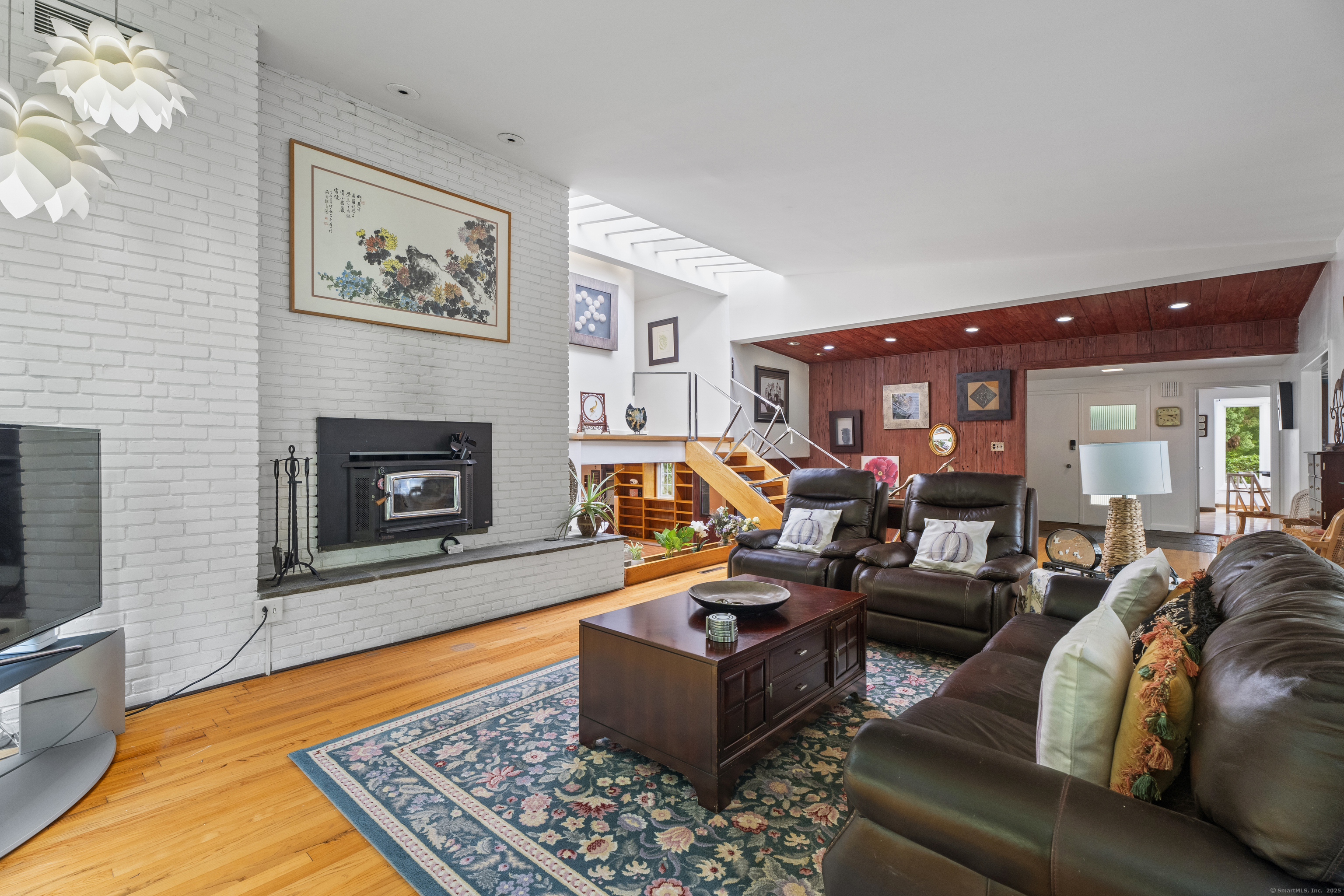 46 Tumblebrook Road Woodbridge, CT 06525 - Photo 4 of 37 Imagine days spent curled up sitting by the fire and watching the snowfall.