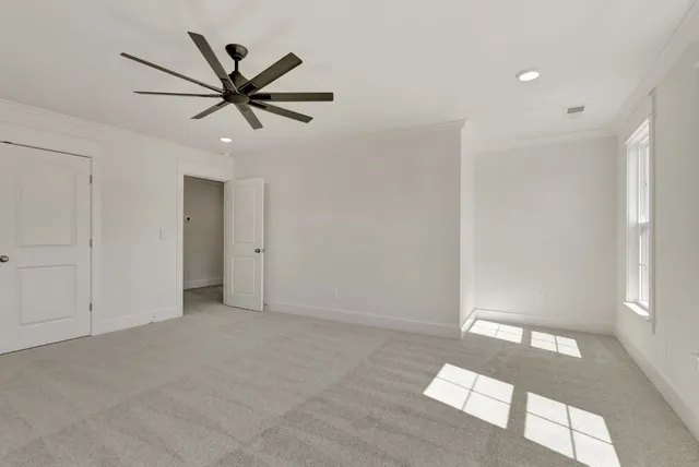 a view of a livingroom with a fireplace and window