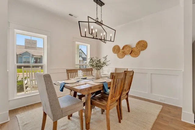 a kitchen with stainless steel appliances a refrigerator a stove top oven and a center island