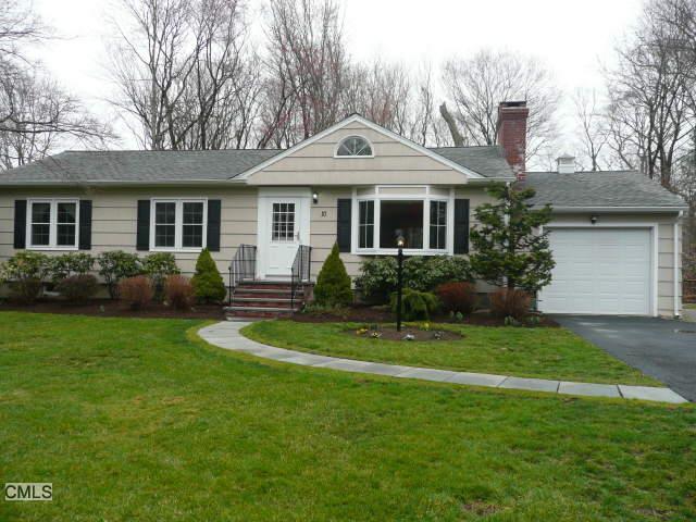10 Overbrook Road Norwalk, CT 06851 - Photo 1 of 1 a front view of a house with a yard and trees