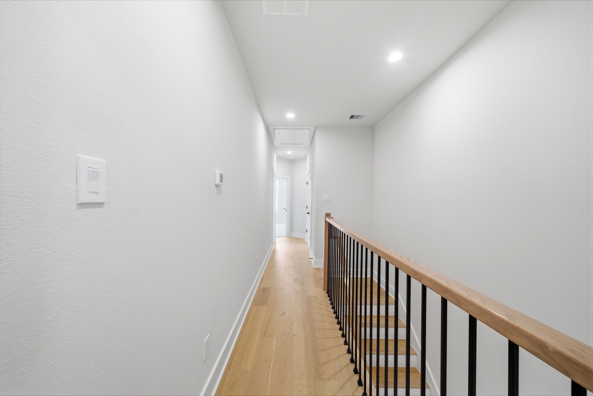328 Janisch Road, Unit C Houston, TX 77018 - Photo 18 of 46 a view of a hallway with wooden floor