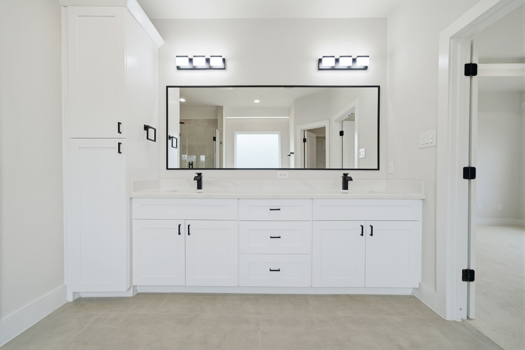 328 Janisch Road, Unit C Houston, TX 77018 - Photo 26 of 46 a bathroom with double sink and a mirror