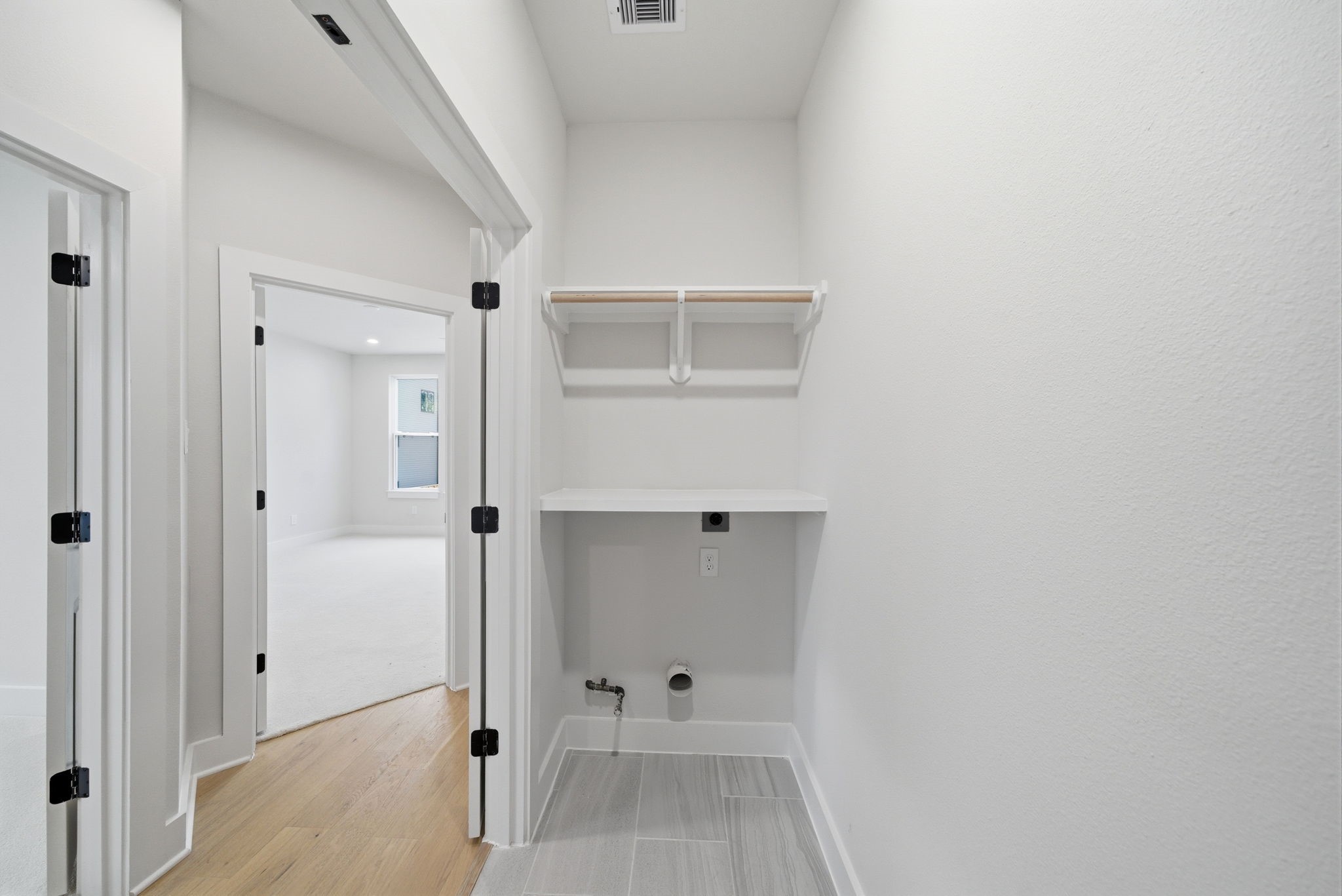 328 Janisch Road, Unit C Houston, TX 77018 - Photo 30 of 46 a view of walk in closet with white walls