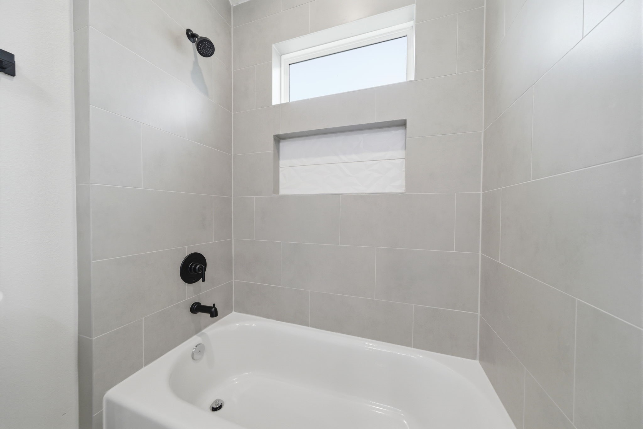 328 Janisch Road, Unit C Houston, TX 77018 - Photo 33 of 46 a bathroom with a tub