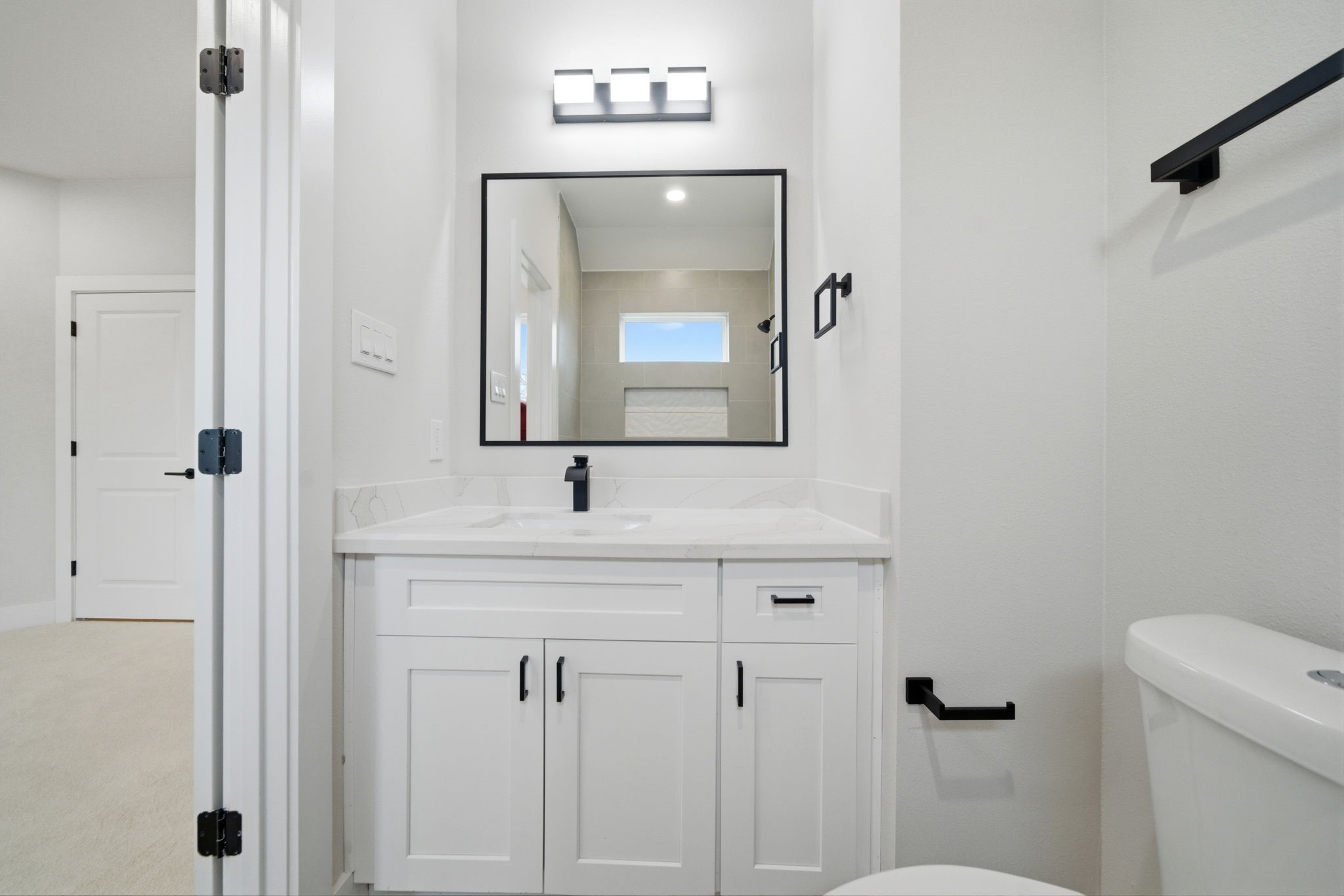 328 Janisch Road, Unit C Houston, TX 77018 - Photo 34 of 46 a bathroom with a sink a toilet and mirror
