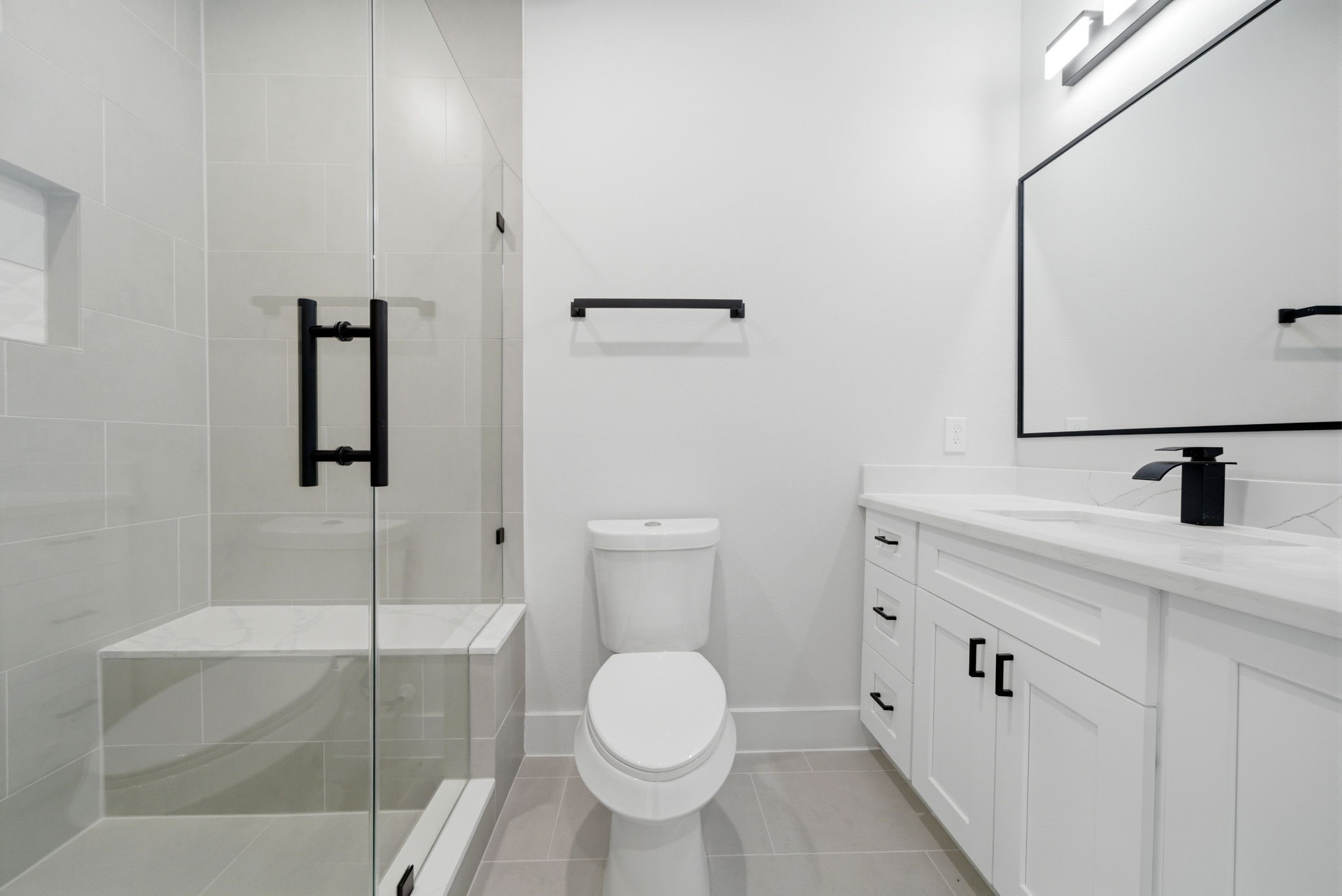 328 Janisch Road, Unit C Houston, TX 77018 - Photo 38 of 46 a bathroom with a toilet sink and mirror