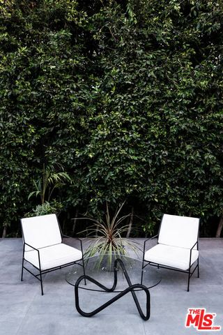 a view from deck having patio