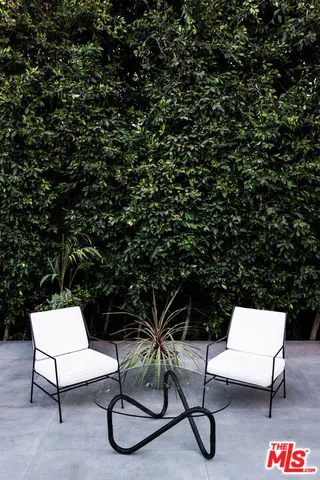 a view from deck having patio