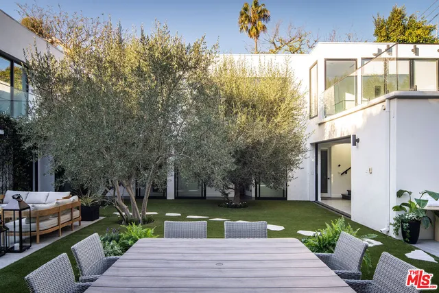 swimming pool view with a seating space