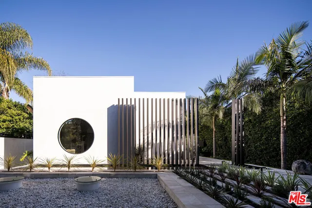 a backyard of a house with barbeque oven