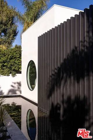a view of a house with a iron gate