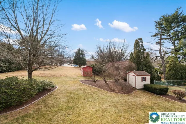 a view of a back yard of the house