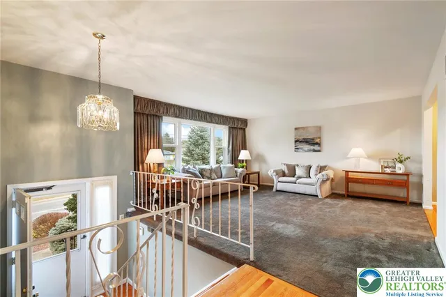 a view of a livingroom with furniture and window