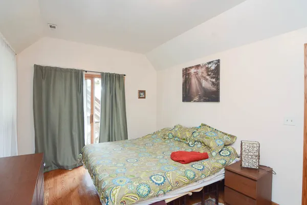 a bedroom with a bed and a table